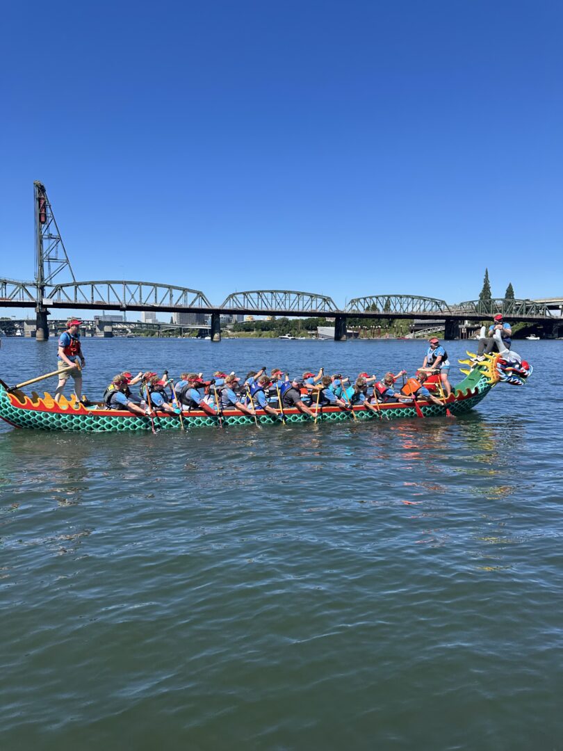 Water Dragons in boat with Hawthrone Bridge in Background